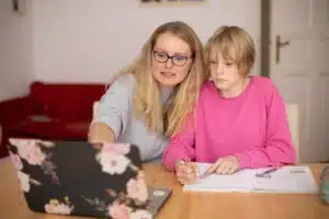 Girl being homeschooled by mom